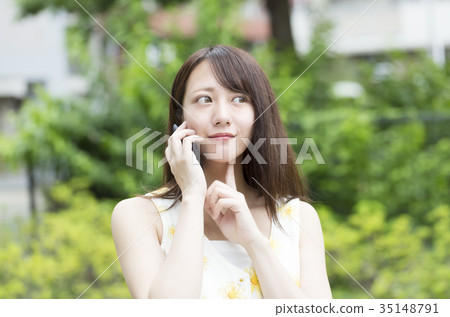 woman talking on smartphone woman talking on smartphone 35148791