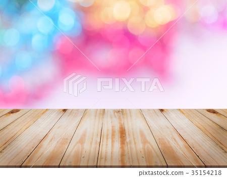 Empty wooden table with lights bokeh background Empty wooden table with lights bokeh background 35154218