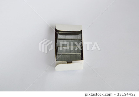 stapler wire in paper box on white background stapler wire in paper box on white background 35154452