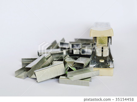 stapler and refill wire on white background stapler and refill wire on white background 35154458