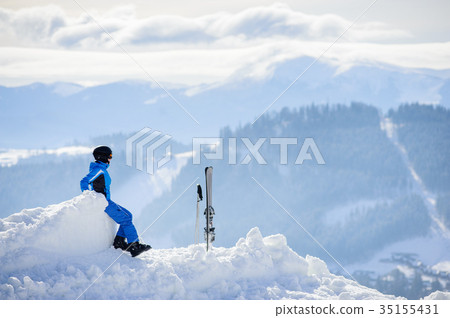 Woman skier on top of the mountain. Winter sports concept Woman skier on top of the mountain. Winter sports concept 35155431