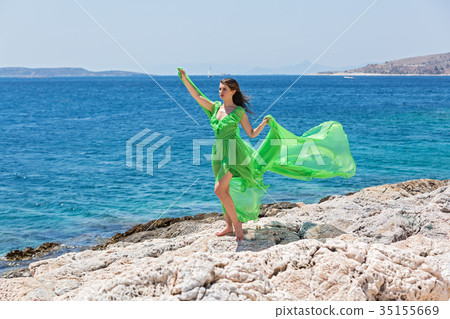 Young woman goes in the sea Young woman goes in the sea 35155669