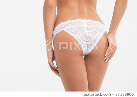 Perfect body young woman on a white background in 35156900