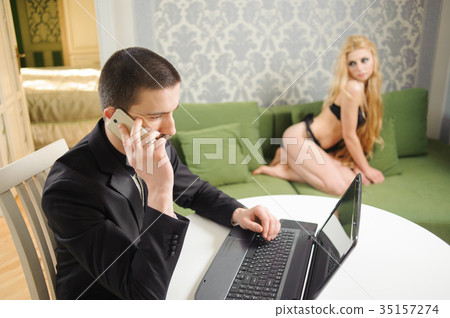 Indoor portrait of young couple, husband and wife 35157274