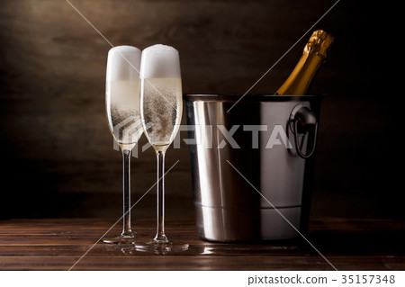 Photo of two glasses with sparkling wine, iron 35157348