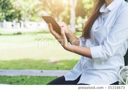 Work and relax, Woman freelancer is working on digital tablet, w 35158673