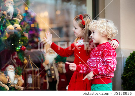 Kids shopping for Christmas presents.  35158936