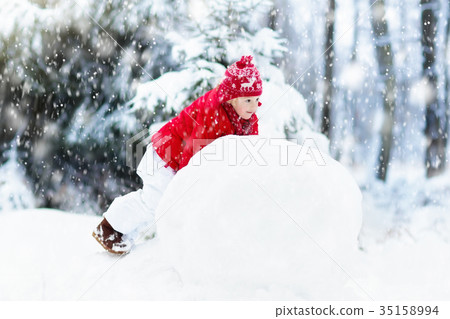 Kids building snowman. Children in snow Winter fun 35158994