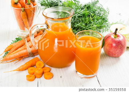 Carrot-apple juice and fresh carrots and apples 35159358