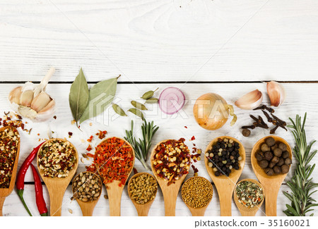 Different spices in wooden spoon. Top view. 35160021