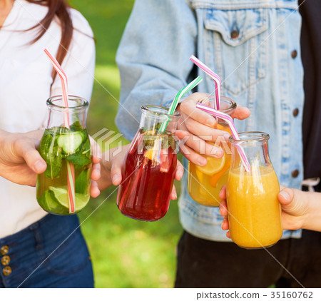 Healthy nutrition. Friends drinking detox tea Healthy nutrition. Friends drinking detox tea 35160762