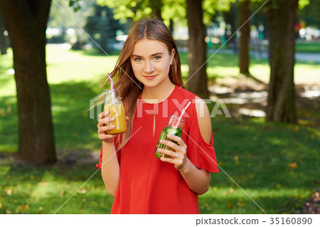 Healthy lifestyle. Happy young woman with detox Healthy lifestyle. Happy young woman with detox 35160890