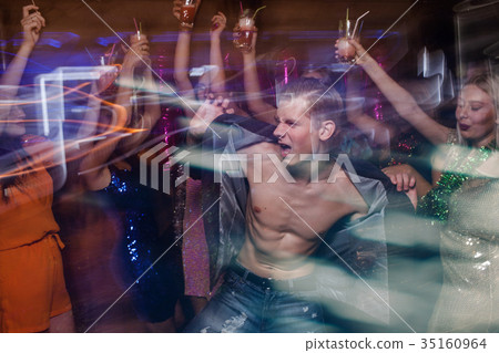 Sexy macho on dance floor 35160964