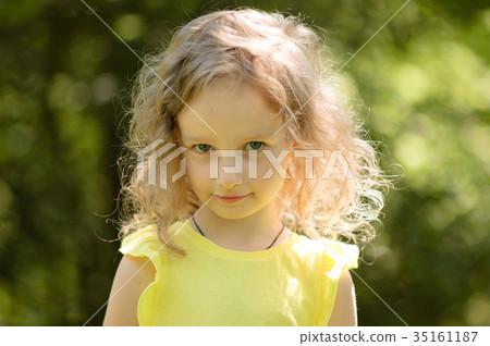 Closeup portrait of a skeptical little girl 35161187