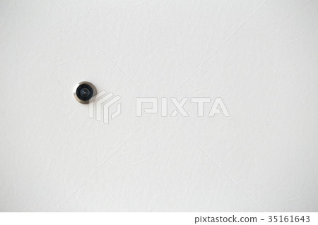 door hole or peephole on white wooden door 35161643