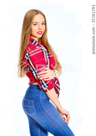 Young sexy woman dressed in jeans and checkered 35161701