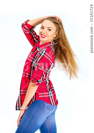 Young sexy woman dressed in jeans and checkered 35161724