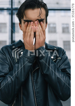 young stressed tired unhappy emotional biker man 35161778