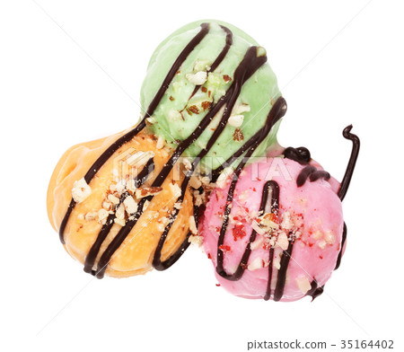 Green red and yellow ice cream ball with melted 35164402