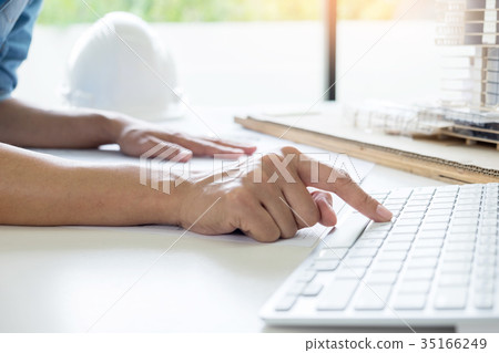 Person's engineer Hand Drawing Plan On Blue Print or working pro Person's engineer Hand Drawing Plan On Blue Print or working pro 35166249