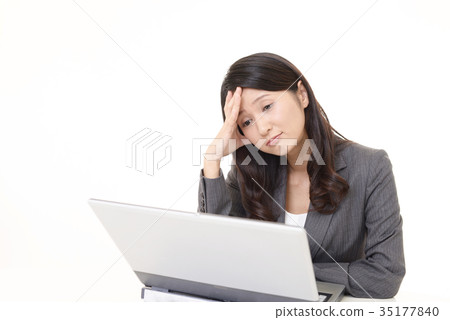 Tired business looking woman Tired business looking woman 35177840