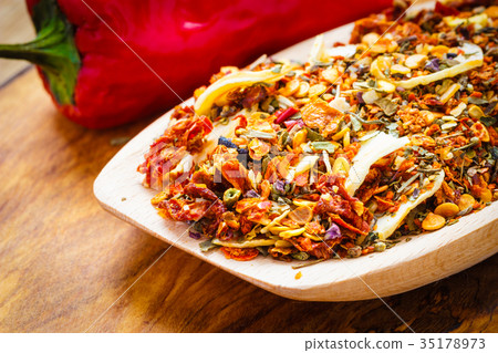 Colored spices for pasta mix on wooden spoon 35178973