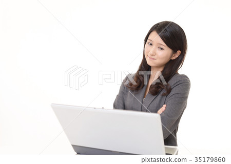 A business woman with an unhappy look A business woman with an unhappy look 35179860