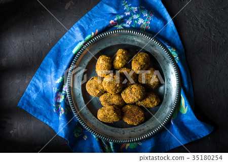 Vegan falafel on a tin plate on a blue napkin 35180254