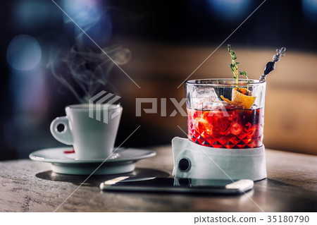 Fresh cocktail drink with coffee and smartphone. 35180790
