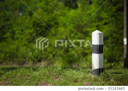 Pillar black and white symbol on the road Pillar black and white symbol on the road 35181665
