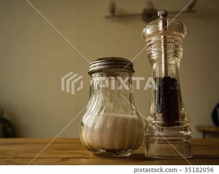 Pepper and Salt in glass on the wooden table Pepper and Salt in glass on the wooden table 35182056