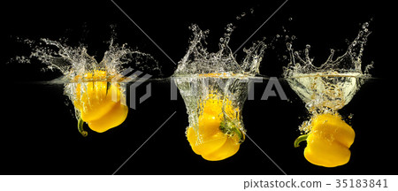 Yellow bell pepper falling in water 35183841
