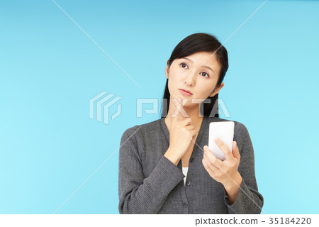 A woman with anxious expression A woman with anxious expression 35184220