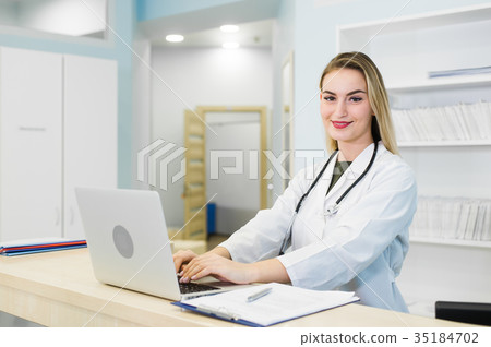 Young smiling receptionist in dental clinic 35184702