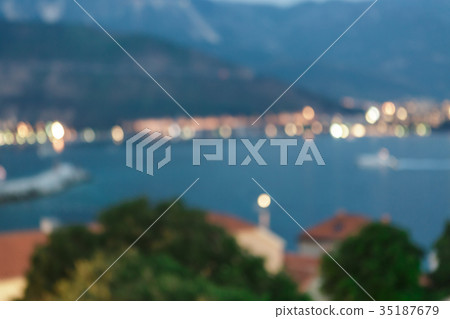blurred background of old city with evening lights blurred background of old city with evening lights 35187679