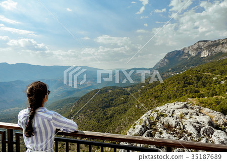 tourist looking at view of Mountains, Montenegro 35187689