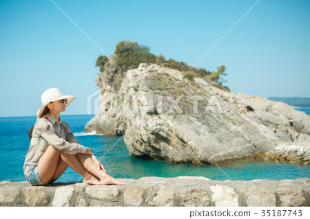 attractive woman in a white hat  35187743