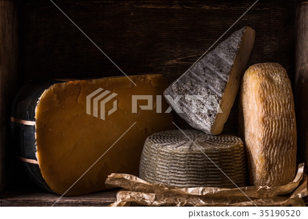 Wooden box with different types of home cheese Wooden box with different types of home cheese 35190520