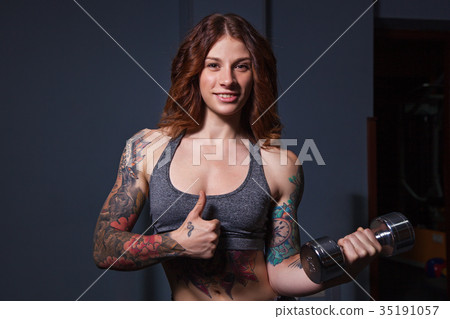 girl with tattoos on fitness 35191057