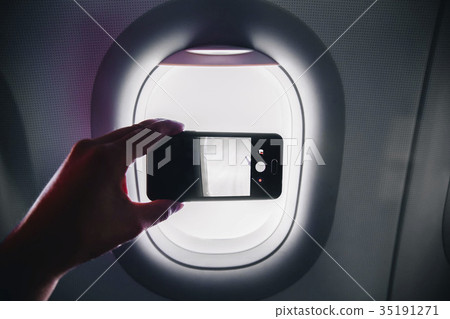 passanger makes photos on the smartphone in the passanger makes photos on the smartphone in the 35191271