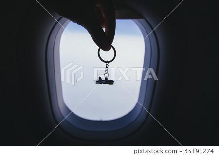 airplane model at the airplane window background airplane model at the airplane window background 35191274