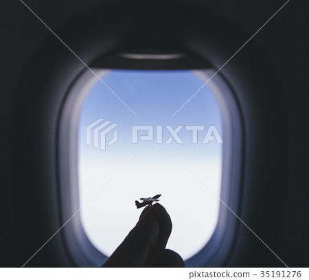 airplane model at the airplane window background airplane model at the airplane window background 35191276