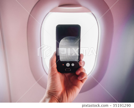 passanger makes photos on the smartphone in the passanger makes photos on the smartphone in the 35191290