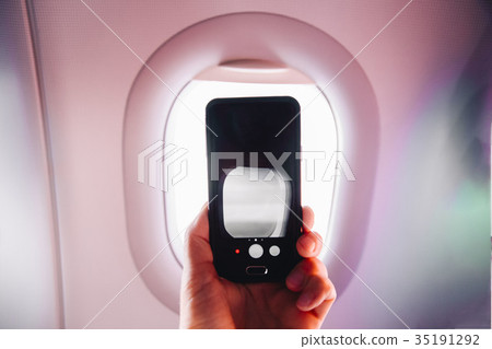 passanger makes photos on the smartphone in the passanger makes photos on the smartphone in the 35191292