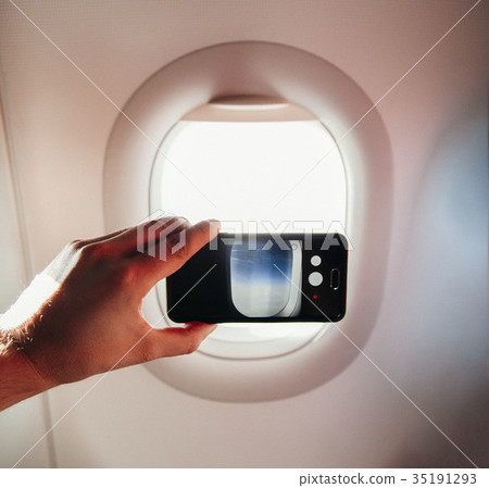 passanger makes photos on the smartphone in the passanger makes photos on the smartphone in the 35191293