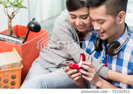 Young Indonesian man makes proposal to girlfriend Young Indonesian man makes proposal to girlfriend 35192032