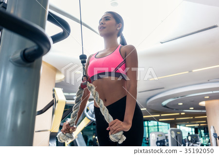 Low-angle view of a beautiful woman exercising 35192050