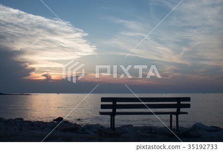 Bench at sunset in Umag 35192733