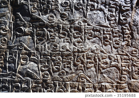 Buddhist religious symbols inscriptions in Tibet old runes 35195688