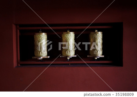 drums with mantras in a Tibetan temple drums with mantras in a Tibetan temple 35198809